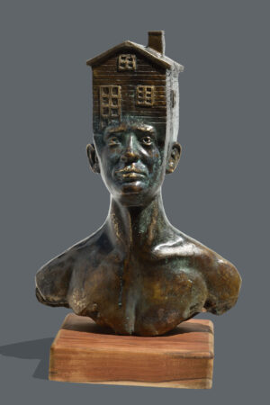 <b>Dushyant Patel </b><br> Man with House <br> Brass and Wood <br> 10 x 28 x 8 Inches<br> 2025