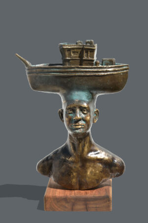 <b>Dushyant Patel </b><br> Man with Boat <br> Brass and Wood <br> 20 x 30 x 8 Inches<br> 2025